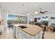 Open kitchen with an island, stainless steel appliances, and water views at 5130 Tidewater Preserve Blvd, Bradenton, FL 34208