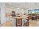 Bright kitchen boasts granite island and breakfast nook at 5130 Tidewater Preserve Blvd, Bradenton, FL 34208