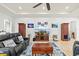 Relaxing living room with comfortable seating and large TV at 5130 Tidewater Preserve Blvd, Bradenton, FL 34208