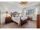 Spacious main bedroom with wood flooring and a large window at 5130 Tidewater Preserve Blvd, Bradenton, FL 34208