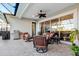 Relaxing outdoor patio area with seating and built-in grill at 5130 Tidewater Preserve Blvd, Bradenton, FL 34208