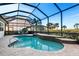 Screened-in pool and patio overlooking a scenic view at 5130 Tidewater Preserve Blvd, Bradenton, FL 34208