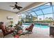 Relaxing screened-in pool area with comfortable seating at 5130 Tidewater Preserve Blvd, Bradenton, FL 34208