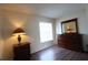 Bright bedroom with wood floors and a dresser at 4105 33Rd Avenue W Dr # 4105, Bradenton, FL 34205