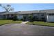 Exterior view of condo showing front entrance, landscaping, and driveway at 4105 33Rd Avenue W Dr # 4105, Bradenton, FL 34205