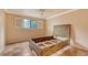 Bedroom with wood platform bed and window shutters at 6724 Schooner Bay Cir # 6724, Sarasota, FL 34231