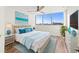 Bright bedroom with ocean views, a comfy bed, and stylish decor at 1055 Beach Rd # B-302, Sarasota, FL 34242