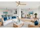 Bright living room with wicker furniture, and coastal decor at 1055 Beach Rd # B-302, Sarasota, FL 34242