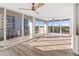 Living room with sliding doors leading to a balcony and ocean views at 1055 Beach Rd # B-302, Sarasota, FL 34242