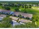 An aerial view shows the building's roof and a picturesque golf course at 6904 Drewrys Blf # 810, Bradenton, FL 34203