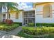 Exterior view of the property, showcasing lush landscaping and a screened lanai at 6904 Drewrys Blf # 810, Bradenton, FL 34203