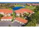 Aerial view of community with golf course and lake at 7187 Boca Grove Pl # 202, Lakewood Ranch, FL 34202