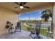 Beautiful screened patio with lake and golf course views, perfect for outdoor lounging at 7187 Boca Grove Pl # 202, Lakewood Ranch, FL 34202