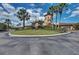 Grand entrance to community center with palm trees at 115 Winding River Trl, Bradenton, FL 34212