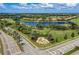 Community entrance with landscaping and fountain at 115 Winding River Trl, Bradenton, FL 34212