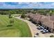 Golf course with clubhouse and golf carts at 115 Winding River Trl, Bradenton, FL 34212