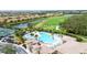 Resort-style pool with expansive deck and surrounding amenities at 115 Winding River Trl, Bradenton, FL 34212