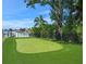 Artificial turf putting green next to the waterfront at 1808 Flower Dr, Sarasota, FL 34239