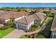 Luxury home community featuring single-Gathering homes with tile roofs and lush landscaping at 8720 Bellussi Dr, Sarasota, FL 34238