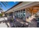 Outdoor patio area with seating and grilling stations at 8720 Bellussi Dr, Sarasota, FL 34238
