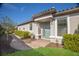 House exterior with a teal door and landscaped walkway at 8720 Bellussi Dr, Sarasota, FL 34238