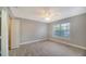 Bright bedroom with tile floors and a large window at 8923 Manor Loop # 106, Lakewood Ranch, FL 34202