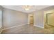 Spacious bedroom with wood-look floors and ample closet space at 8923 Manor Loop # 106, Lakewood Ranch, FL 34202