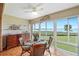 Bright dining room with water views and hardwood floors at 4752 Independence Dr # 4752, Bradenton, FL 34210