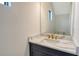 Modern bathroom with gray vanity and quartz countertop at 2612 Star Apple Way, Sarasota, FL 34240