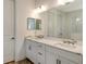 Elegant bathroom with double vanity, quartz countertops, and a large mirror at 2612 Star Apple Way, Sarasota, FL 34240