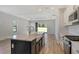 Kitchen island with white quartz countertop and gold faucet at 2612 Star Apple Way, Sarasota, FL 34240