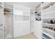 Walk-in closet featuring custom shelving, drawers, and hanging space for organization at 111 S Pineapple Ave # 613, Sarasota, FL 34236