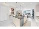 Contemporary kitchen with an island, connecting to the dining and living areas for an open, modern feel at 111 S Pineapple Ave # 613, Sarasota, FL 34236