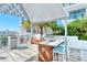 Outdoor kitchen and bar area for entertaining with a stainless steel grill and scenic city views at 111 S Pineapple Ave # 613, Sarasota, FL 34236