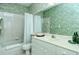 Bathroom with a single vanity, toilet, bathtub, and shower with curtain at 111 Woodbridge Dr # 202, Venice, FL 34293