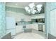 Bright kitchen with white cabinetry, stainless steel appliances, and eat-in space at 111 Woodbridge Dr # 202, Venice, FL 34293