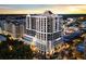 Aerial view of high-rise building in vibrant city setting at 50 Central Ave # 17Phc, Sarasota, FL 34236