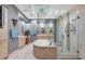 Spa-like bathroom with a soaking tub and walk-in shower at 50 Central Ave # 17Phc, Sarasota, FL 34236