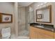 Modern bathroom with walk-in shower and granite countertop at 50 Central Ave # 17Phc, Sarasota, FL 34236