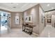 Elegant entryway with contemporary art and a console table at 50 Central Ave # 17Phc, Sarasota, FL 34236