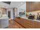 Modern kitchen with a herringbone floor and wine storage at 50 Central Ave # 17Phc, Sarasota, FL 34236