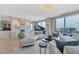 Large living room with curved sofa and city views at 50 Central Ave # 17Phc, Sarasota, FL 34236