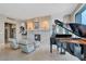 Spacious living room with grand piano and city views at 50 Central Ave # 17Phc, Sarasota, FL 34236