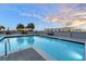 Inviting rooftop pool with city skyline views at sunset at 50 Central Ave # 17Phc, Sarasota, FL 34236