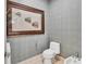 Stylish powder room with contemporary wall art at 50 Central Ave # 17Phc, Sarasota, FL 34236