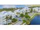 Waterfront condo complex featuring serene lake, tropical landscaping, and well-maintained facilities at 7820 34Th W Ave # 102, Bradenton, FL 34209