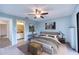 Main bedroom with ceiling fan and ensuite bathroom at 947 Sunridge Way # A-3, Sarasota, FL 34234