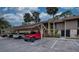 Condo building with covered parking and landscaping at 947 Sunridge Way # A-3, Sarasota, FL 34234