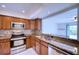 Modern kitchen featuring granite countertops and stainless steel appliances at 947 Sunridge Way # A-3, Sarasota, FL 34234