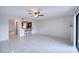 Bright living room with tile floor and access to patio at 947 Sunridge Way # A-3, Sarasota, FL 34234